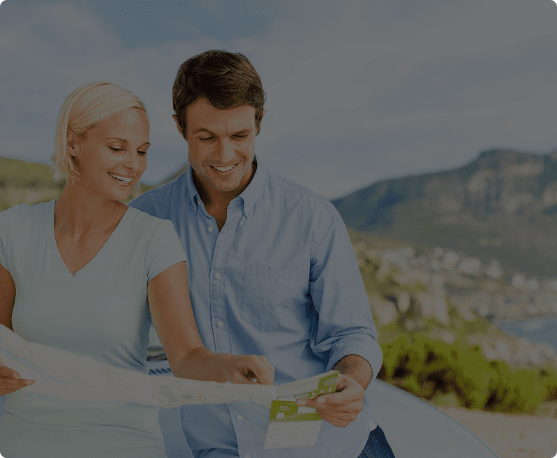 A man and woman looking at something on the screen.